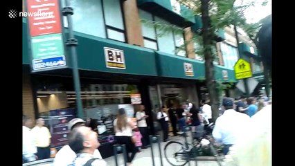 People watch solar eclipse in New York City