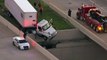 Truck dangles from highway overpass in Texas
