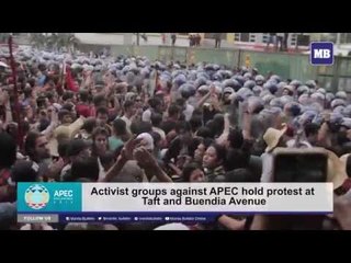Anti-APEC protesters march down Buendia towards Roxas Boulevard