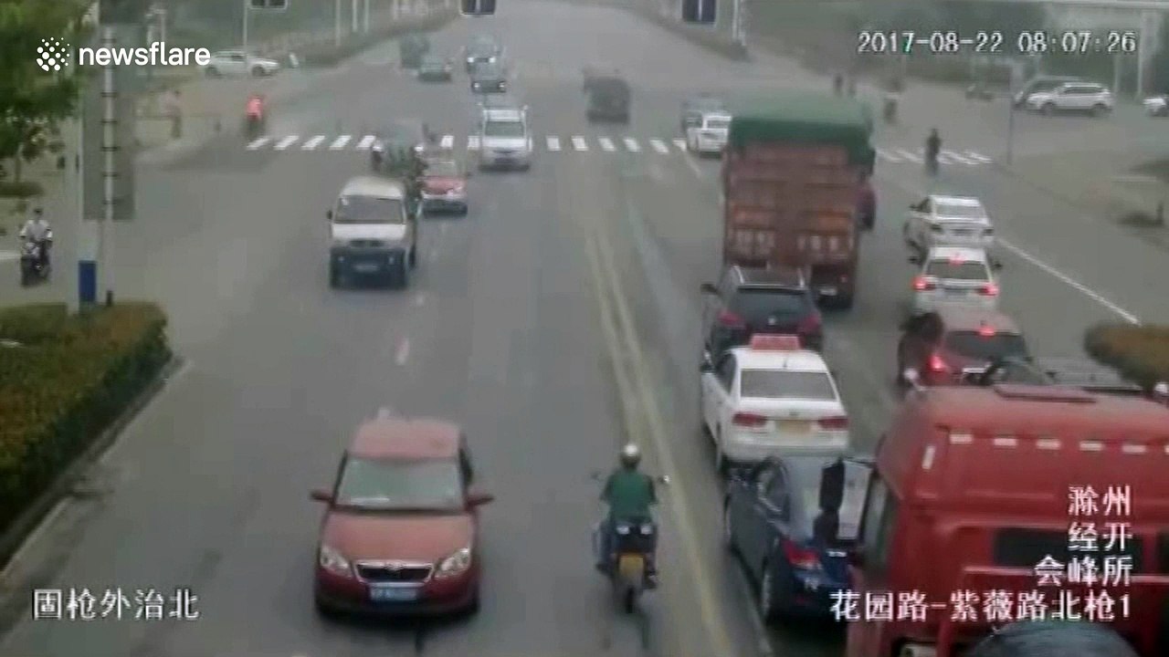 Lucky escape as biker comes inches from having his head run over