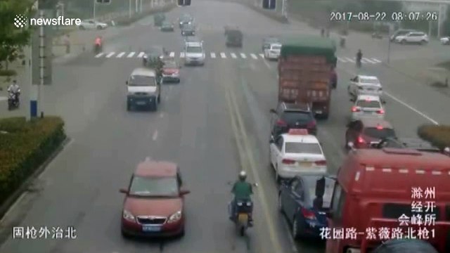 Lucky escape as biker comes inches from having his head run over