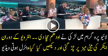 Little Girl Climbs on The Studio During Alastair Stewart Interview