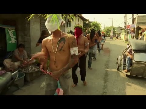 Catholic devotees re-enact Jesus' suffering