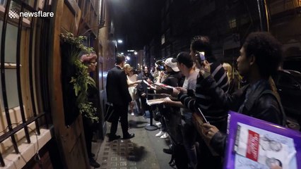 Sienna Miller signs autographs in Grenfell Tower tribute shirt