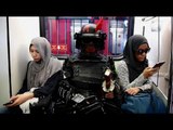 Cosplayers travel on Malaysian public transport