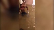 Man tries to catch fish with bare hands in flooded Texas home