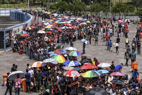 Football fans queueing for tickets turn rowdy