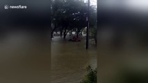 Man rides jet ski in Houston flood during Hurricane Harvey