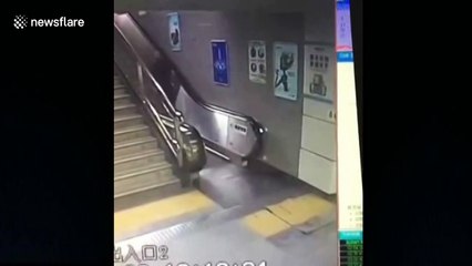 Terrifying moment woman falls through manhole in station