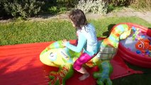ASSISTANT Inflatable Water Slide Challenge Funny and Huge Toys Bounce House Video