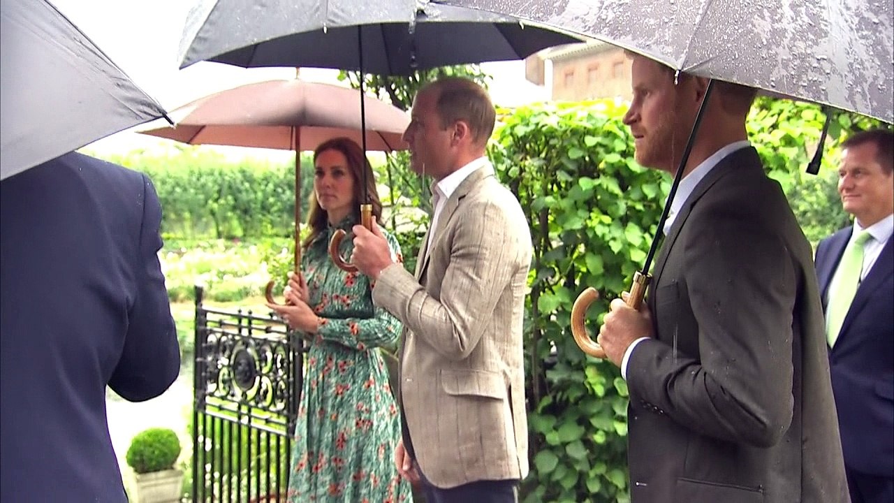 Brollies out for royal tour of Kensington Palace gardens