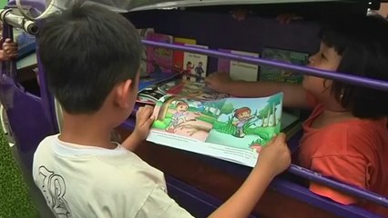 Three-wheeled 'Bemo' Driver Brings Books, Movies To Jakarta's Children