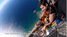 Naked skydiving musician plays violin during jump