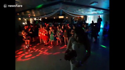 Women fight for bouquet at wedding in Canada