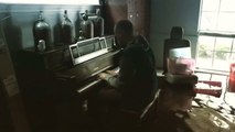 Houston musician plays piano in flooded home