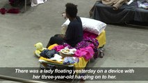 Exhausted and scared, Harvey victims shelter in Louisiana