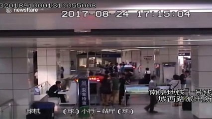Man climbs into security scanner at underground station