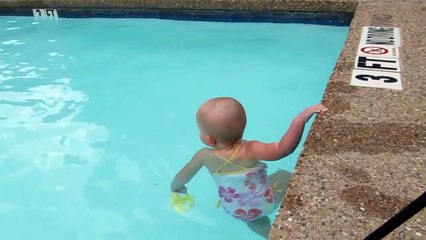 Toddler swims solo in the pool
