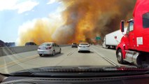 Slow motion dash cam footage shows LA fire engulf freeway