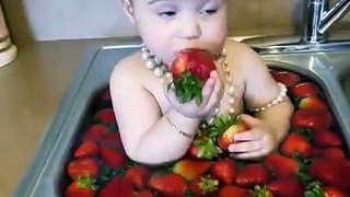 Amazing baby girl soo cute eating strawberries