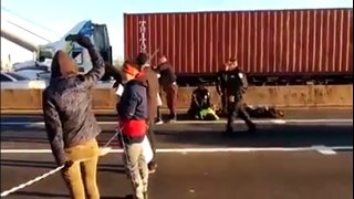 PROTESTERS ATTEMPT TO BLOCK BRIDGE DURING RUSH HOUR