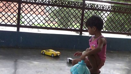 rosy lali |rosy lali playing with her yellow electronic car and blue doll