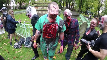Zombies walk through the streets of London for charity