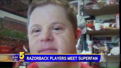 University of Arkansas Football Players Surprise Superfan with Down Syndrome