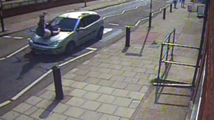 Driver runs down pedestrian and reverses away