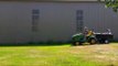 Young Son Takes Injured Dad for a Ride While Mowing the Lawn