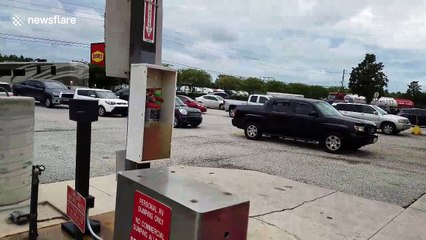 Cars line up at Florida petrol station before Hurricane Irma hits