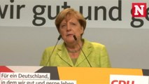 Angela Merkel booed and heckled during German election campaign event