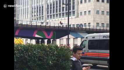 Dramatic moment man is saved from Canary Wharf railway bridge