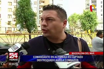 Comandante en actividad de la PNP es captado destrozando auto a combazos