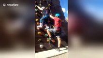 Woman with cerebral palsy conquers climbing wall