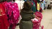 Little Girl Pushing Pink Stroller in Shopping Centre