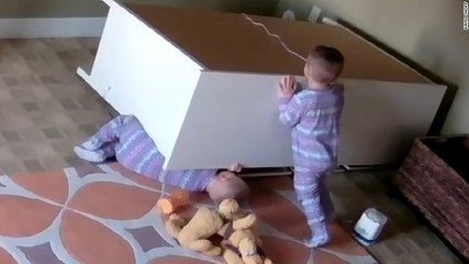 Boy races to catch baby brother as he falls :)