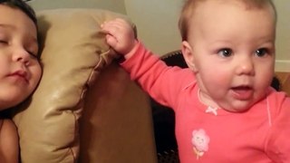 Cute Baby sister tries to wake her big brother funny HD