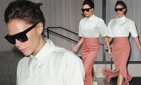 Victoria Beckham flashes legs in pink pencil skirt in NY