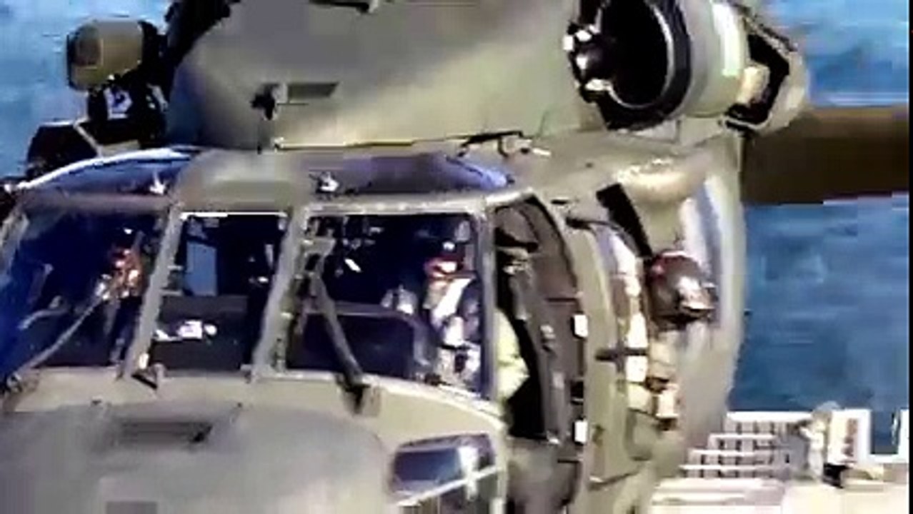 Amazing helicopter landing on sea Ship