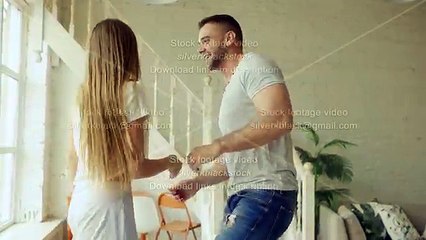 Young beautiful and loving couple dancing and kissing on bed in the morning at home (2)