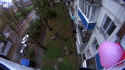 Man in Russia surprises girlfriend by hanging van on crane