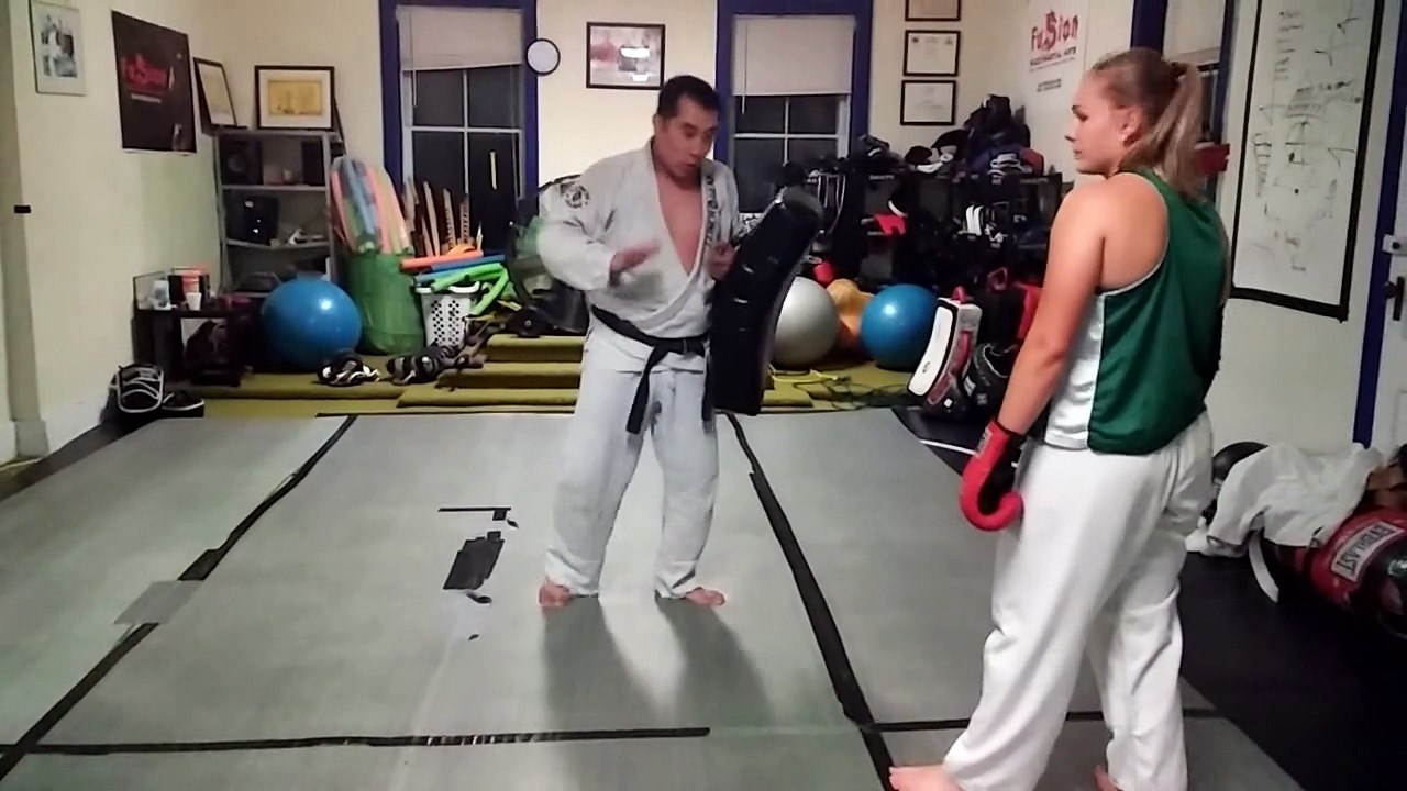 Paige kicking the shield-