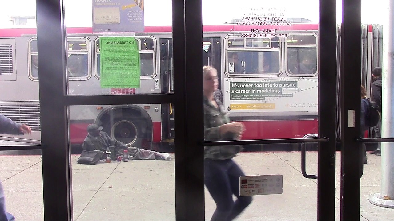 Homeless living on the edge - by bus stop on Fillmore st 9-13-2017