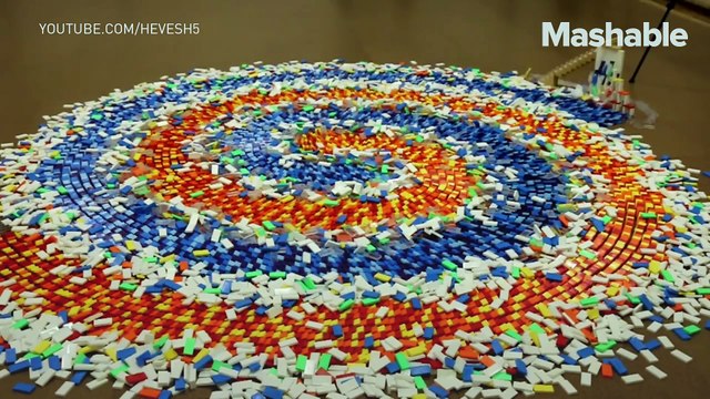This triple spiral of 15,000 dominoes falling down is incredibly satisfying to watch
