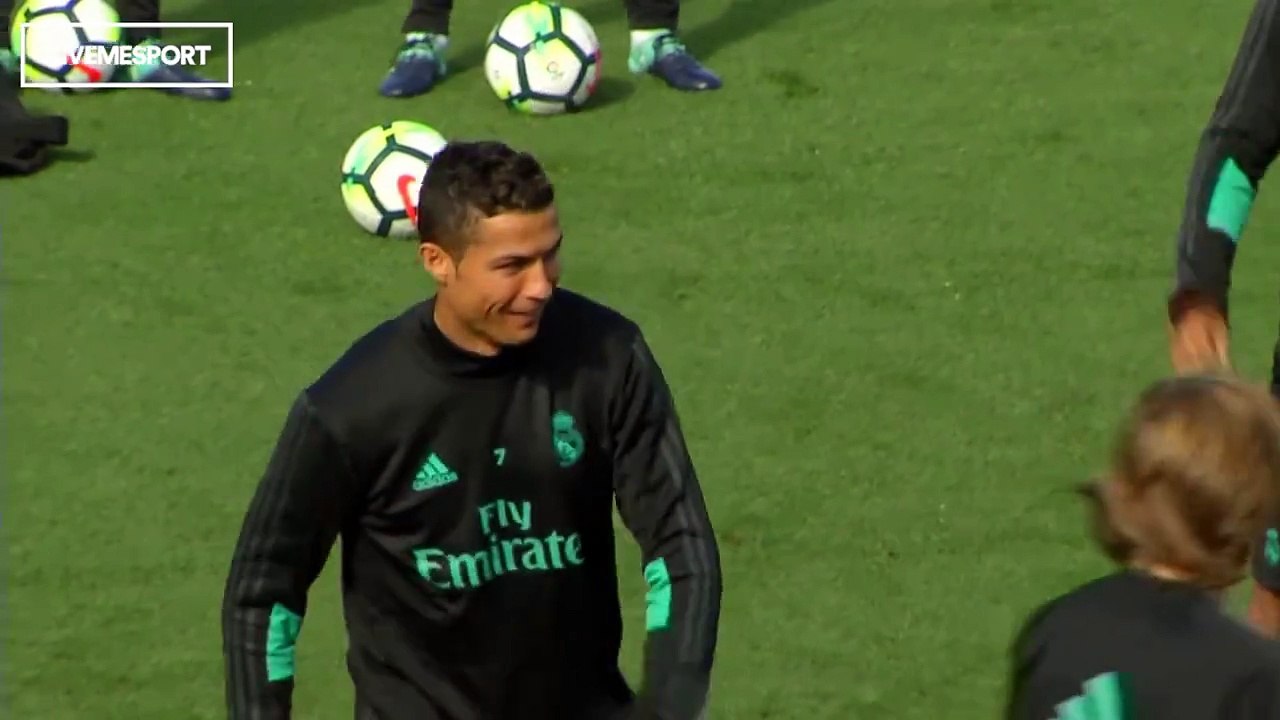 Steady on mate... Cristiano Ronaldo shows off abs during training.
