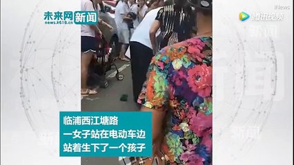 Mother gives birth in the street