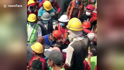 Mexico quake survivor carried away on stretcher