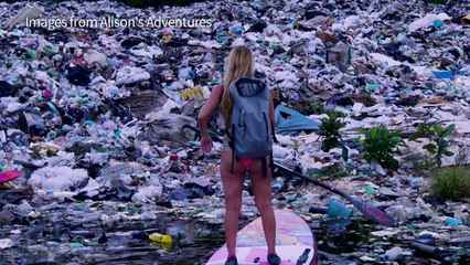 Surfing eco-warrior takes dip under Paris's Eiffel Tower