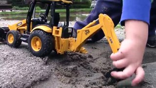 Rétrocaveuse chat creusement fouilleur pour dans enfants boue jouet camions construction frère jcb